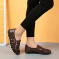 Women's casual flat shoes with Velcro fastening in black, showing round toe and beef tendon sole