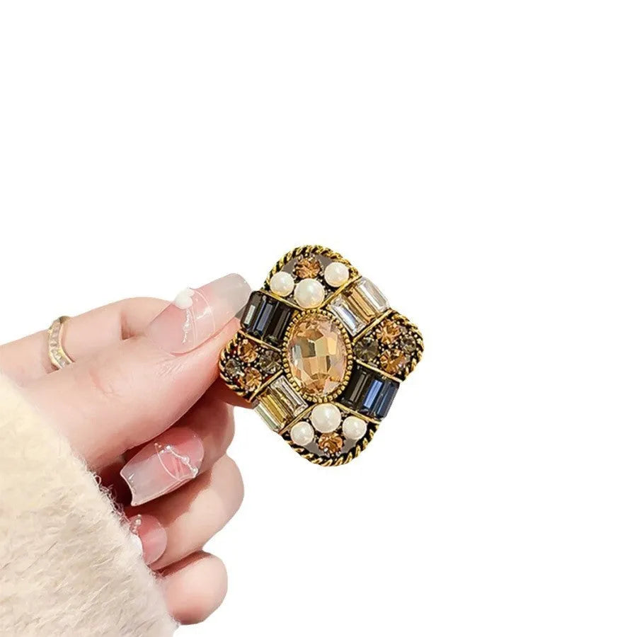 Alloy brooch in natural flower shape with electroplated finish, featuring adjustable and anti-exposure pin closure for women's coats and suits.