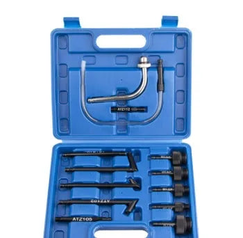 Automatic transmission oil refuelling tool kit with injector and connectors on a workshop bench
