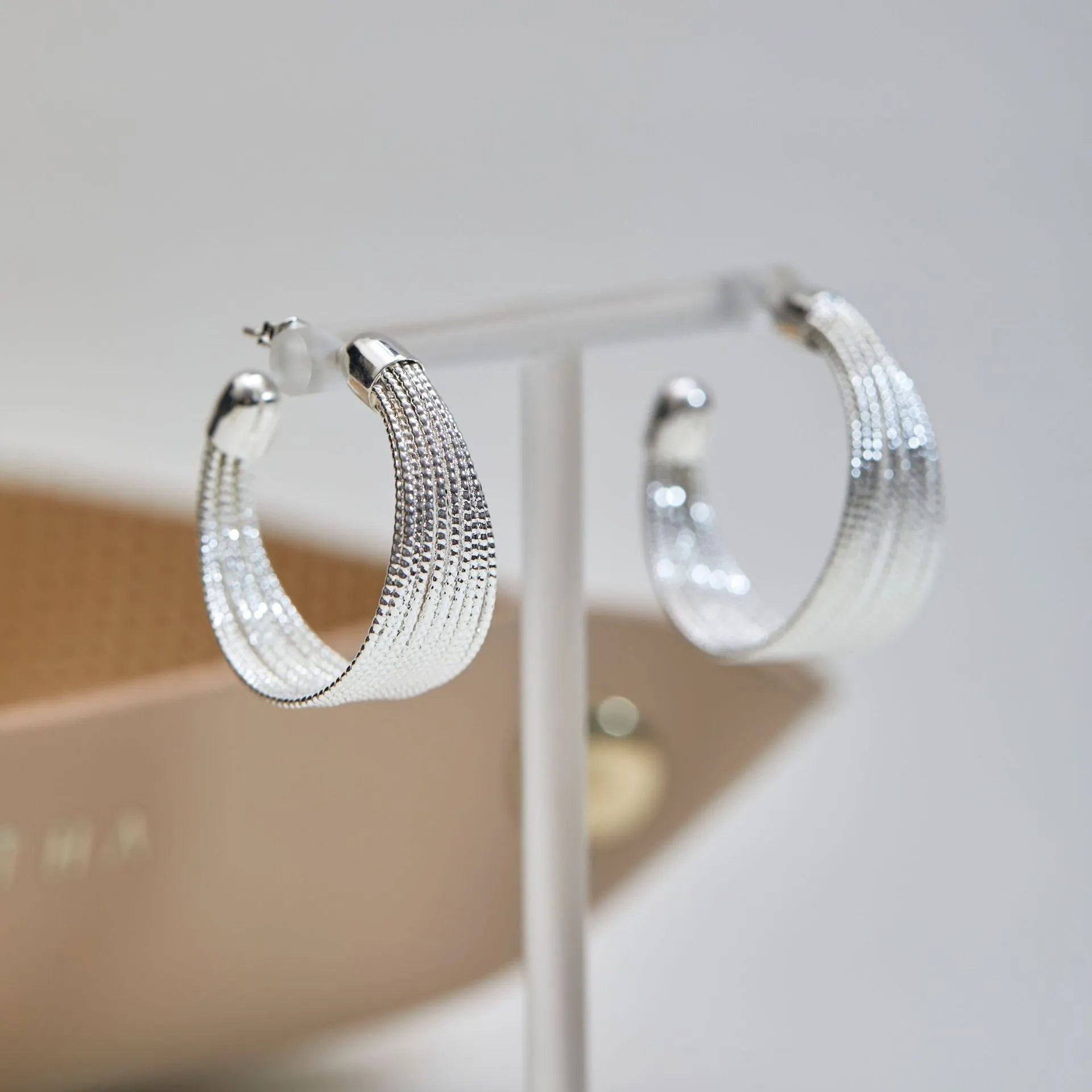 Geometric copper stud and clip earrings in gold and silver electroplated colours with simple multi-layer design