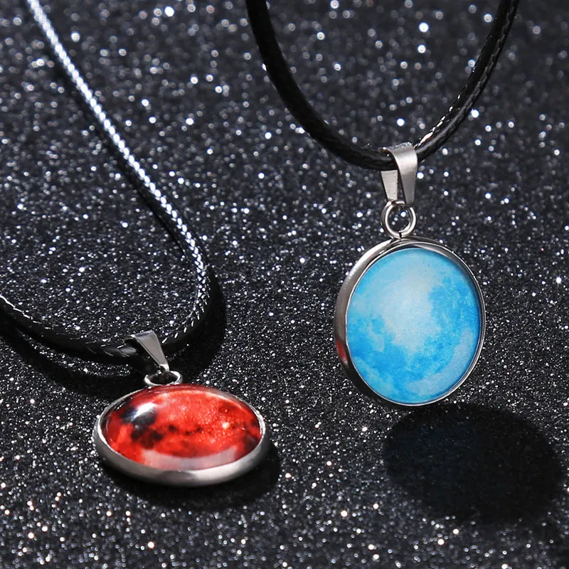 Luminous constellation pendant necklace with adjustable chain on a plain background.