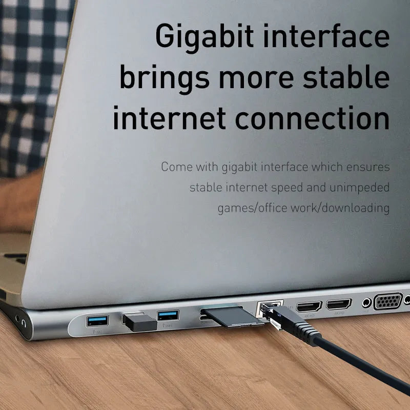 Grey aluminium laptop docking station with cooling bracket and ten ports including HDMI, VGA, and Ethernet.