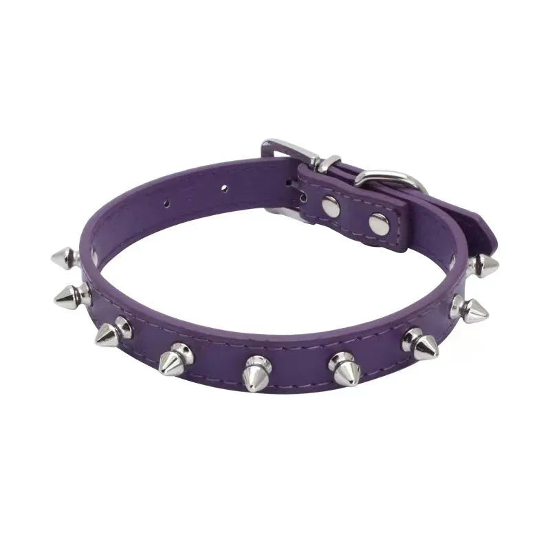 Studded dog collar in black PU leather with metal spikes and alloy buckle.