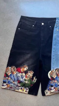 Blue cotton men's shorts with a Jesus Christ screen print on the back pocket, showing tapered leg fit.