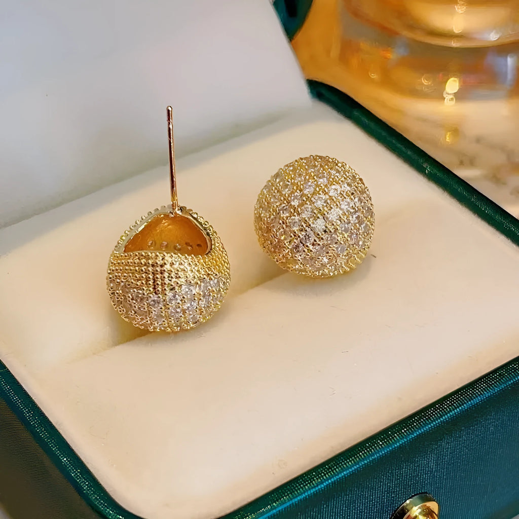 Geometric drop ear clips with diamond-cut golden beans in gold or white colour