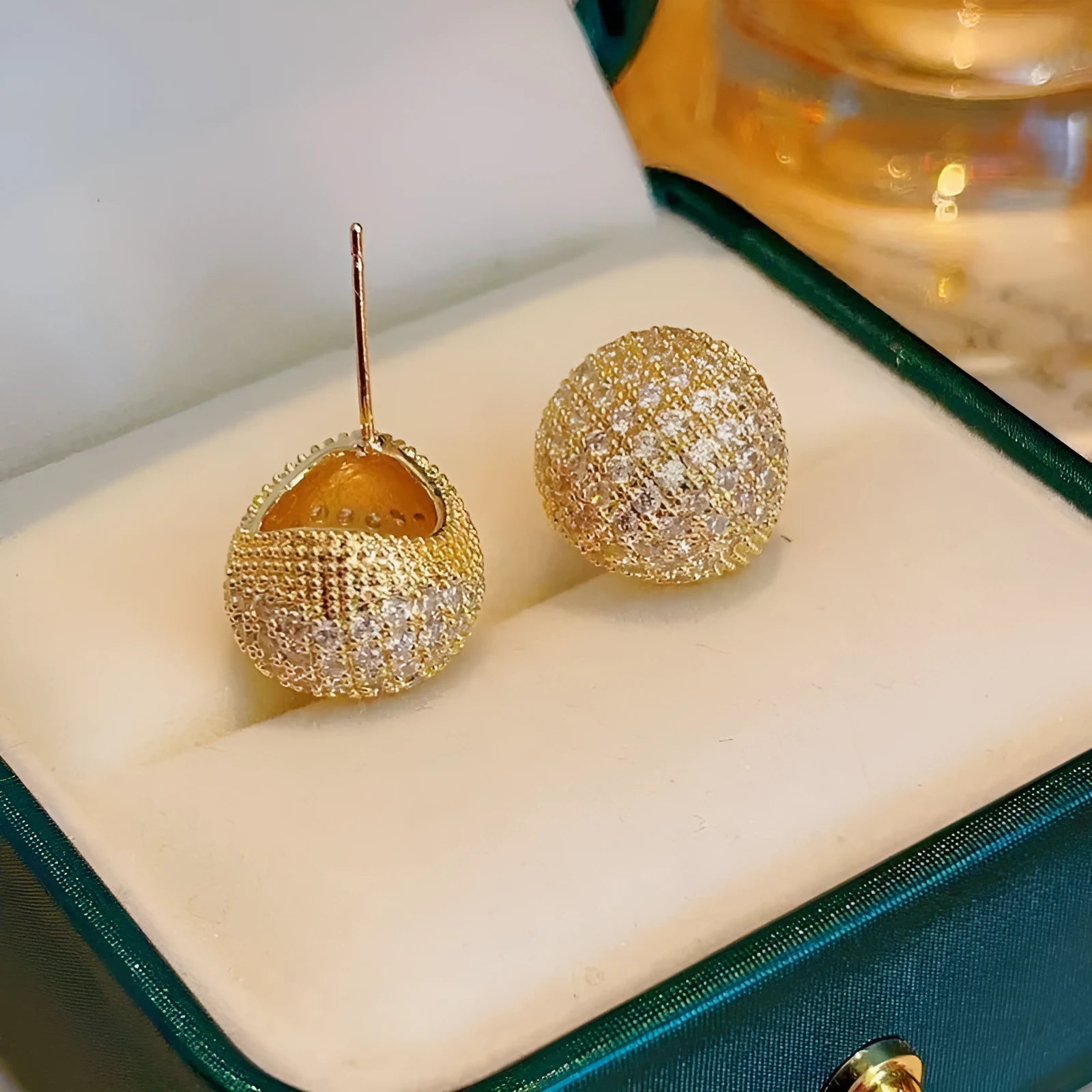 Geometric drop ear clips with diamond-cut golden beans in gold or white colour
