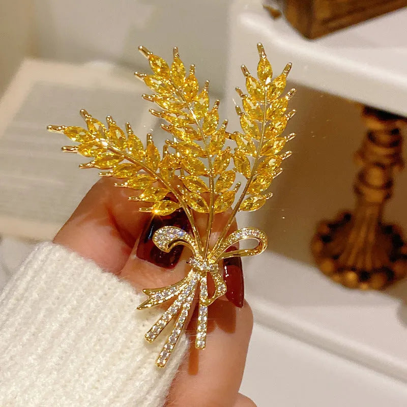 Alloy brooch in natural flower shape with electroplated finish, featuring adjustable and anti-exposure pin closure for women's coats and suits.