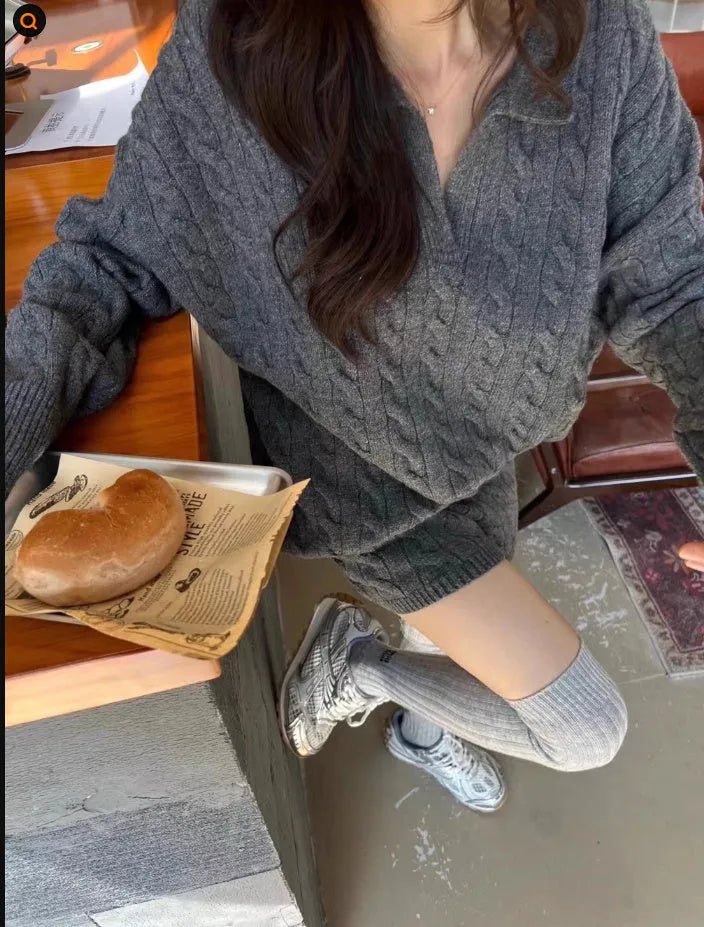Ladies creamy-white knitted suit set with geometric cable knit sweater and elastic waist shorts