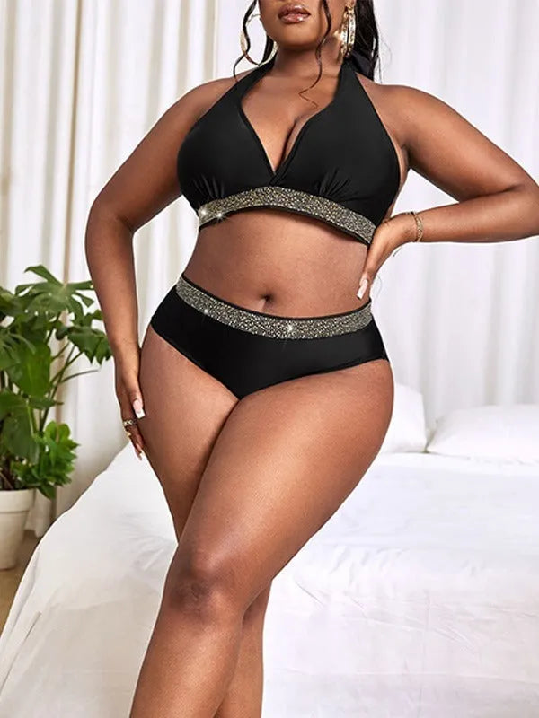 Black plus size women's bikini swimsuit with sleeveless bra and shorts on a mannequin.