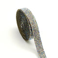 A one-yard long self-adhesive electroplated glass rhinestone strip on a roll, shown in white and AB colour variants.