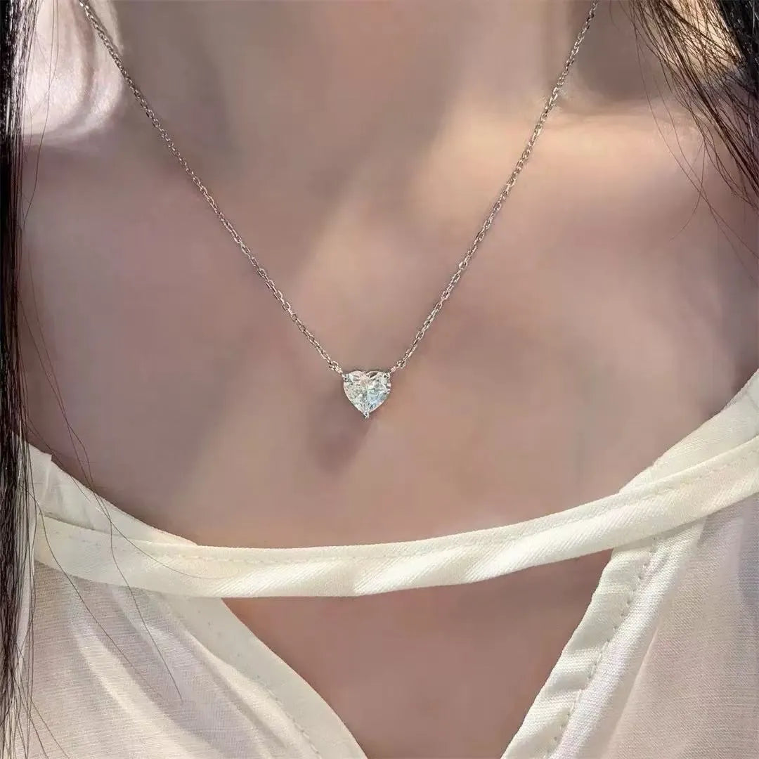 Silver-coloured copper love heart pendant necklace for women on a 16-inch chain.