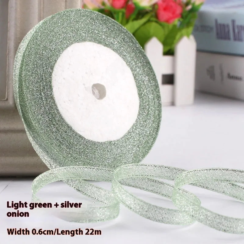 Roll of 0.6cm wide polyester gift ribbon in various colours including gold leaf, coffee and sky blue options
