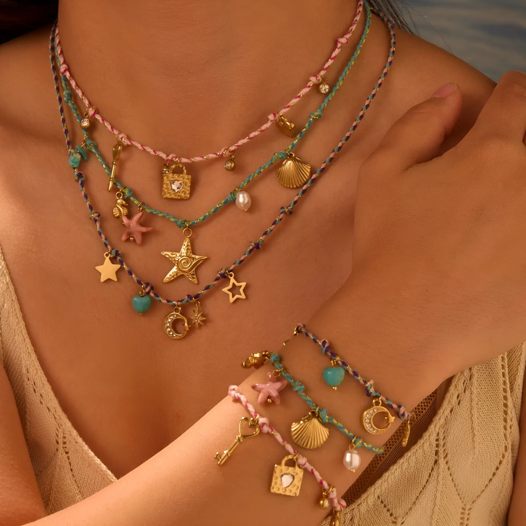 Handmade braided rope titanium steel necklace and bracelet set with 18K gold electroplated heart, star, and geometric pendants.
