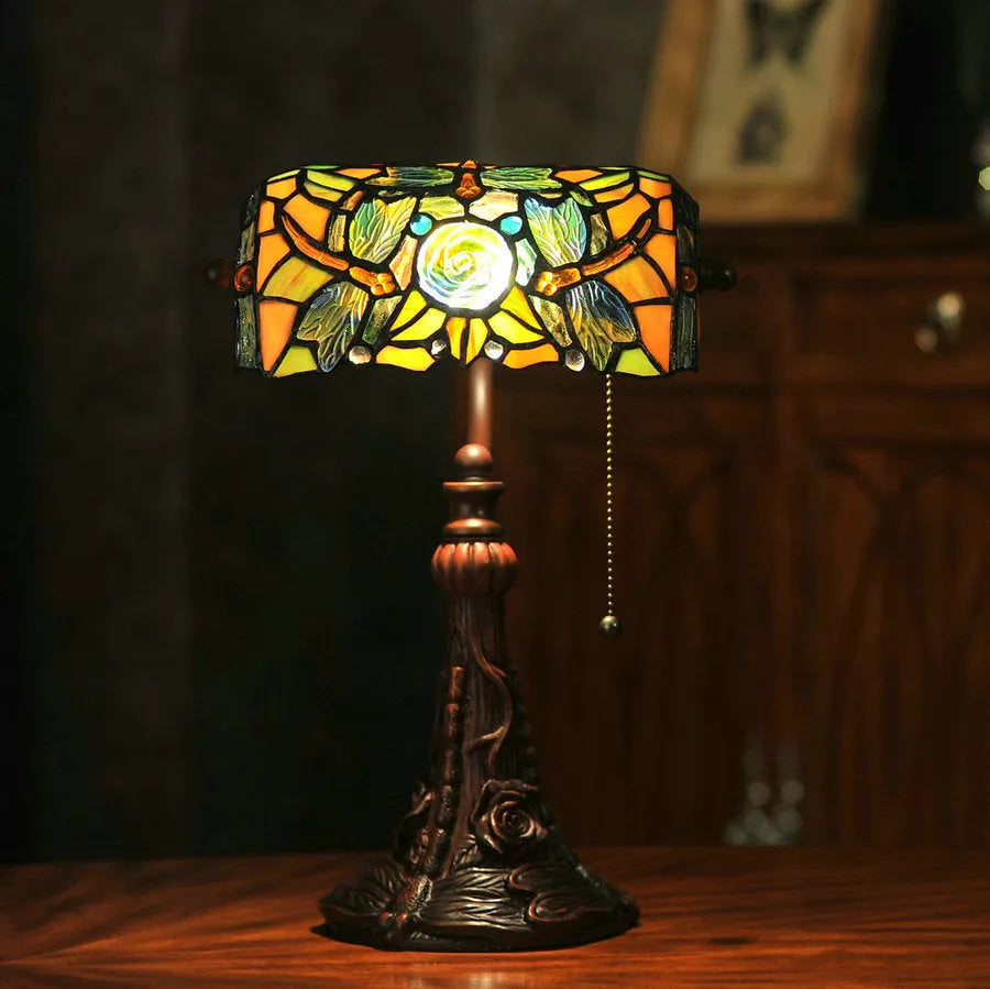 10-inch Tiffany table lamp with coloured stained glass resin shade on a desk.