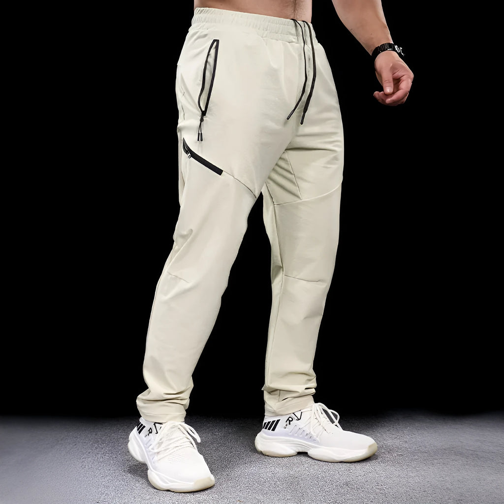 Men's nylon workout pants in mid-waist cut with quick-drying properties for sports and fitness