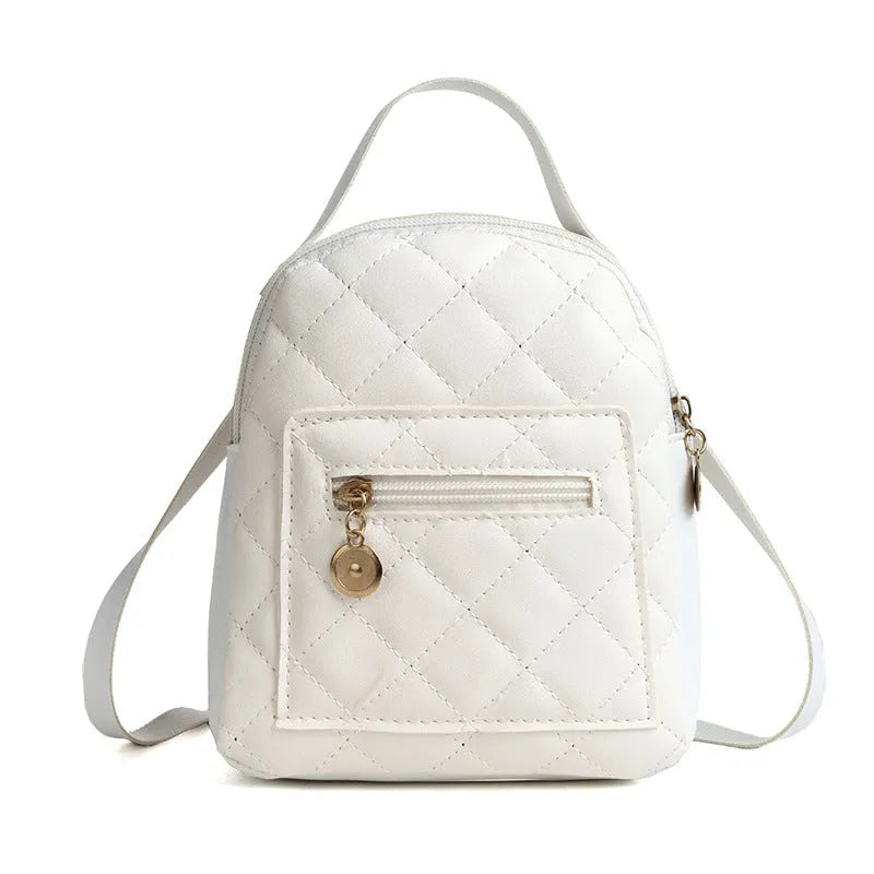 Hard white Korean style embroidered girls backpack showing sandwich pocket and soft carry handle.
