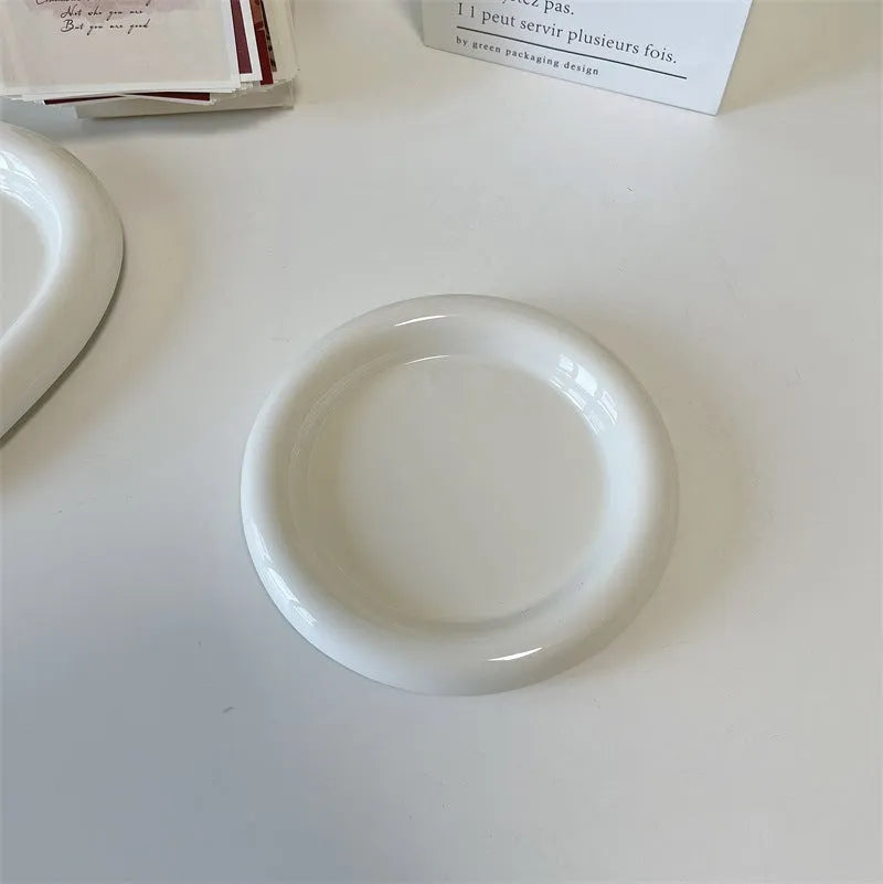 White ceramic plate with doodle design showing bear pattern, suitable for microwave use