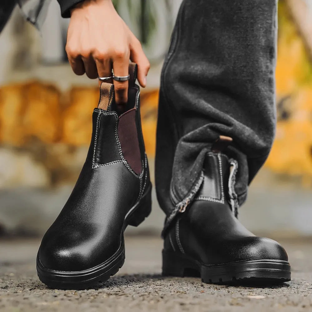A pair of vintage-style unisex Chelsea boots in artificial PU leather with a beef tendon sole