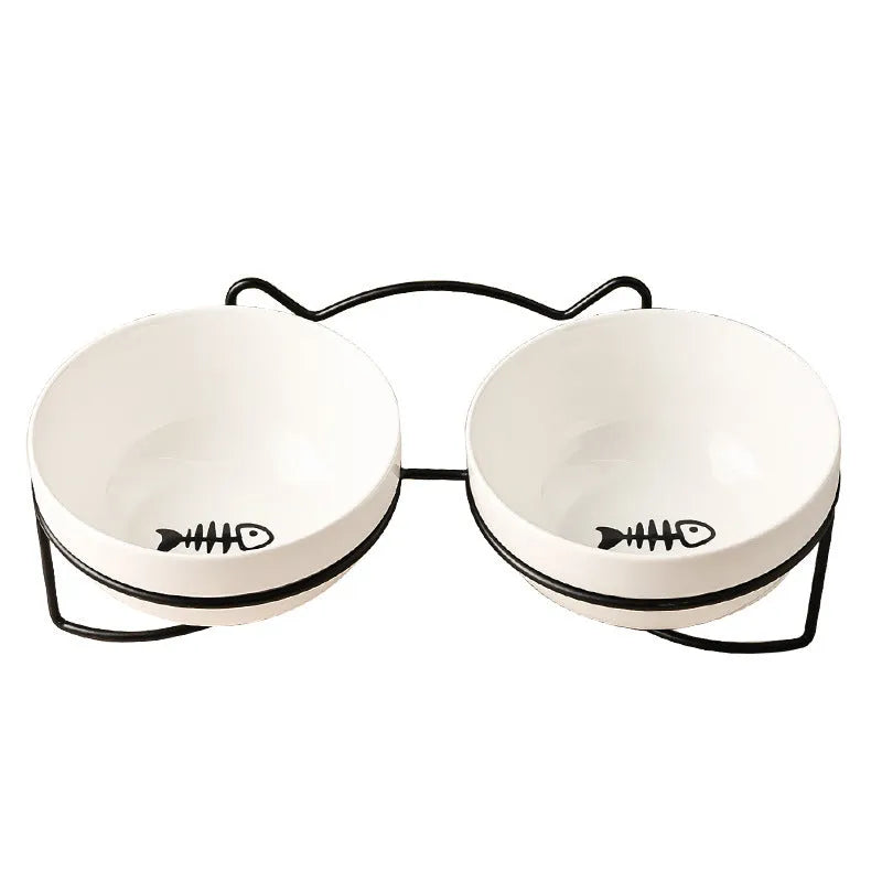 White ceramic cat bowl with decorative patterns on iron frame with cat ear details