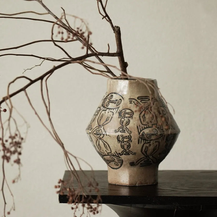Hand-painted ceramic cylindrical vase with tribal totem patterns in vintage carved style