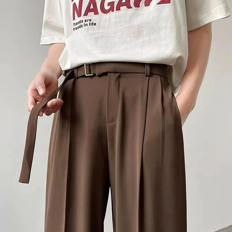 Thin straight leg black wide trousers with non-ironing finish and loose fit casual style