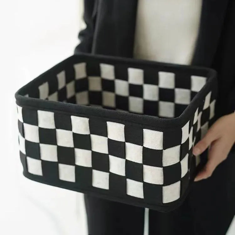 Checkerboard pattern woven felt folding storage box measuring 37cm by 29cm by 19.5cm