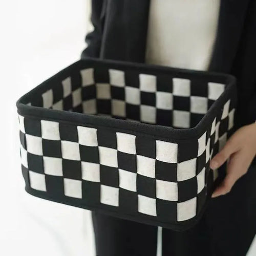 Checkerboard pattern woven felt folding storage box measuring 37cm by 29cm by 19.5cm