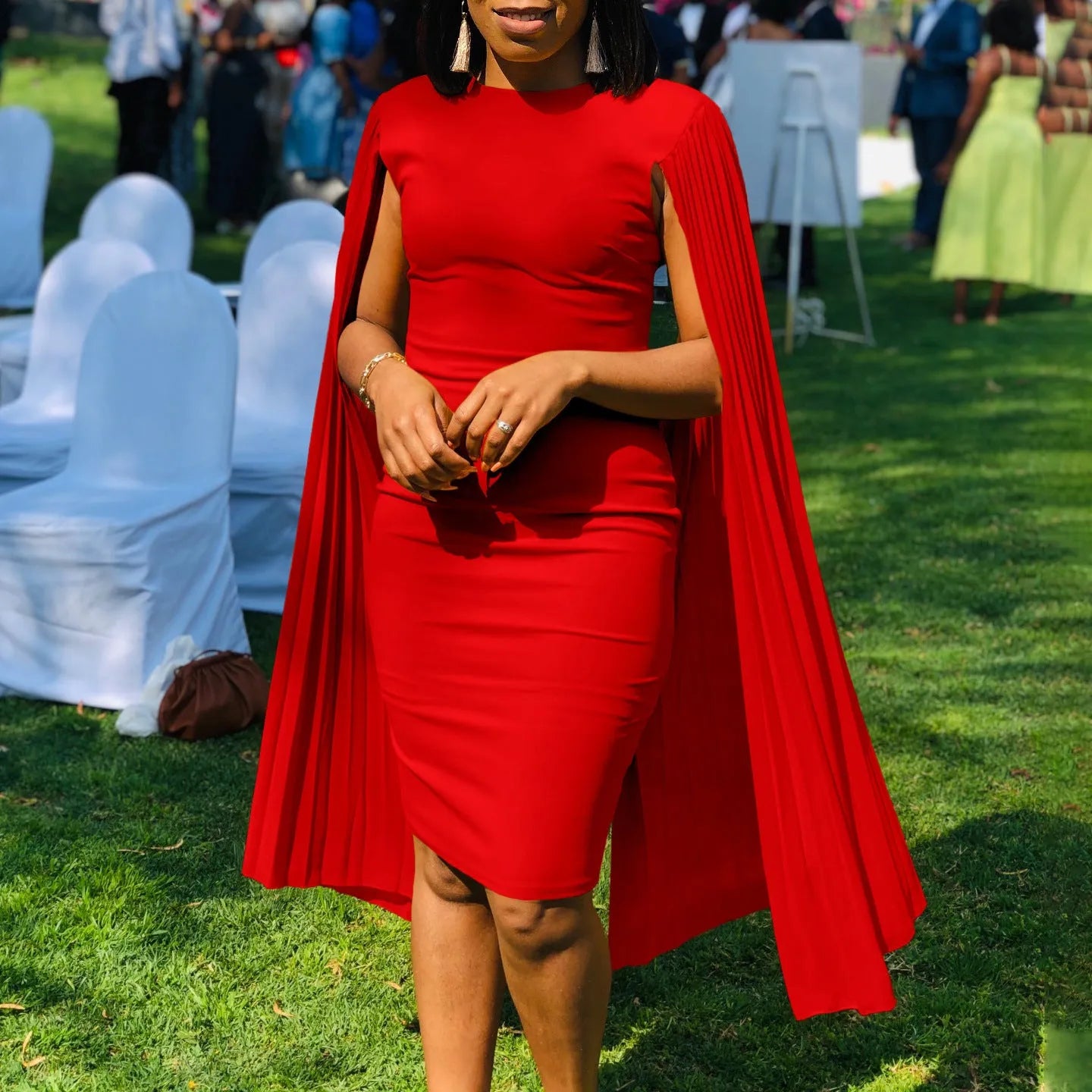 Round neck high waist evening gown with long sleeves and a pleated shawl in yellow, orange, red, or green.