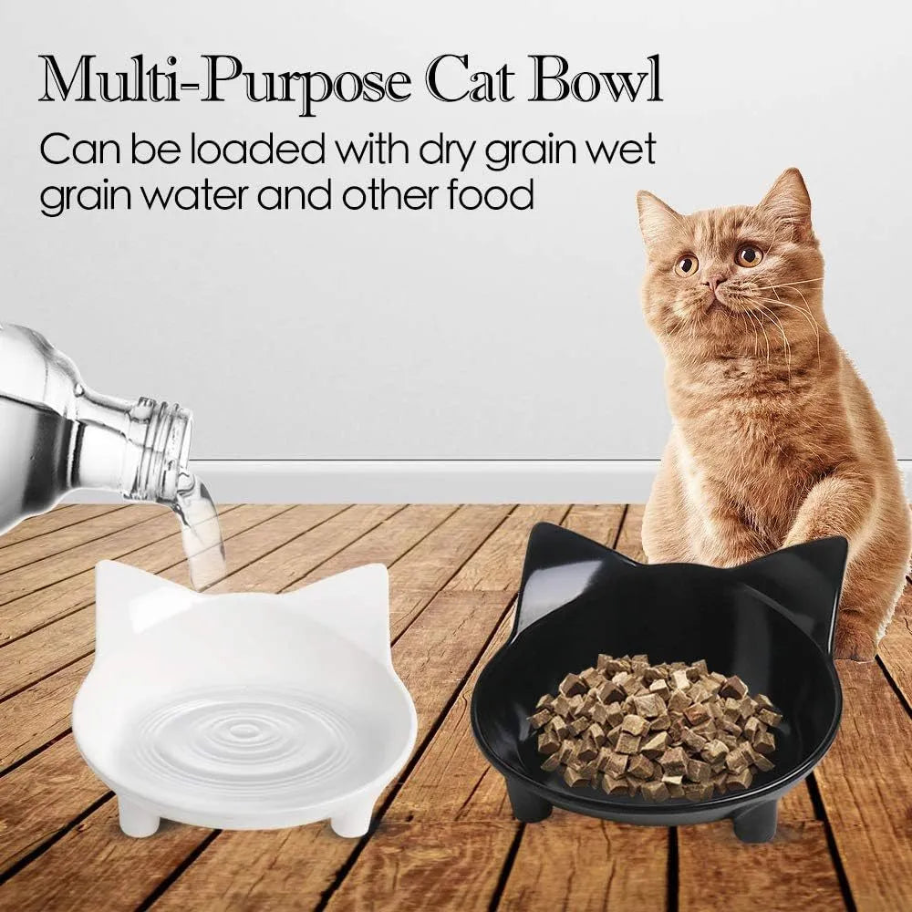 White shallow melamine cat bowl with non-slip rubber base on a wooden table.