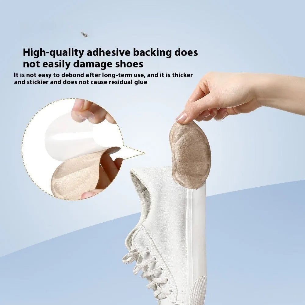 Camel-coloured anti-blister heel cushion pads with suede surface measuring 9.3x6 cm