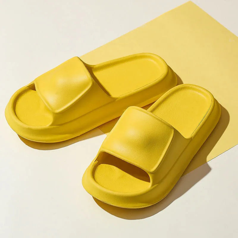 Soft EVA flip-flop slippers with thick sole in multiple colours on a white background.