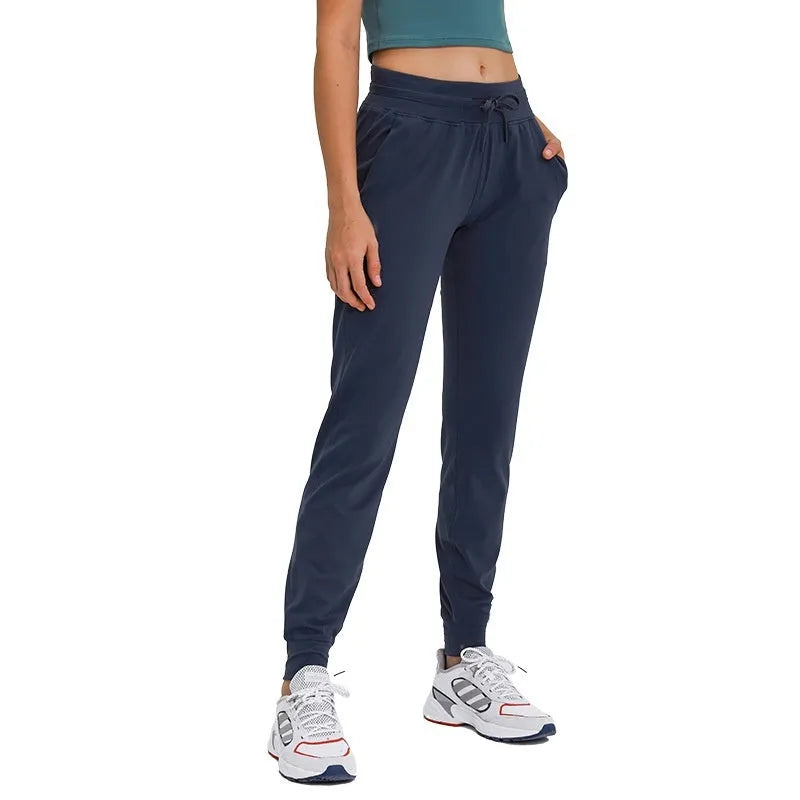 Women's high-waist yoga pants in distilled coffee colour with an elastic drawstring waist for fitness.