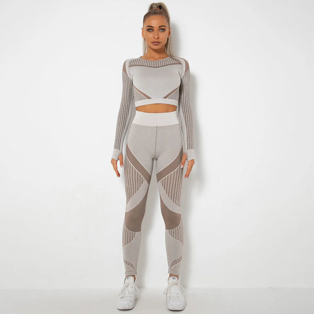 Women's long-sleeved seamless knitted yoga suit in a neutral colour, showing the stretch fabric and close fit.
