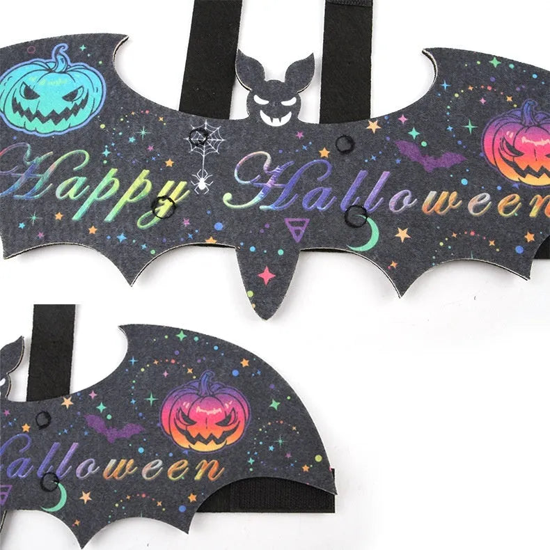 Halloween batwing costume for a cat or small dog made from orange and black felt.