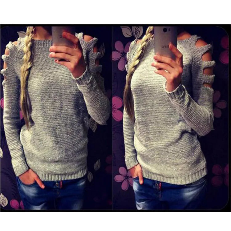 Women's grey crocheted hollow-out long-sleeved shirt with a round neck on a hanger