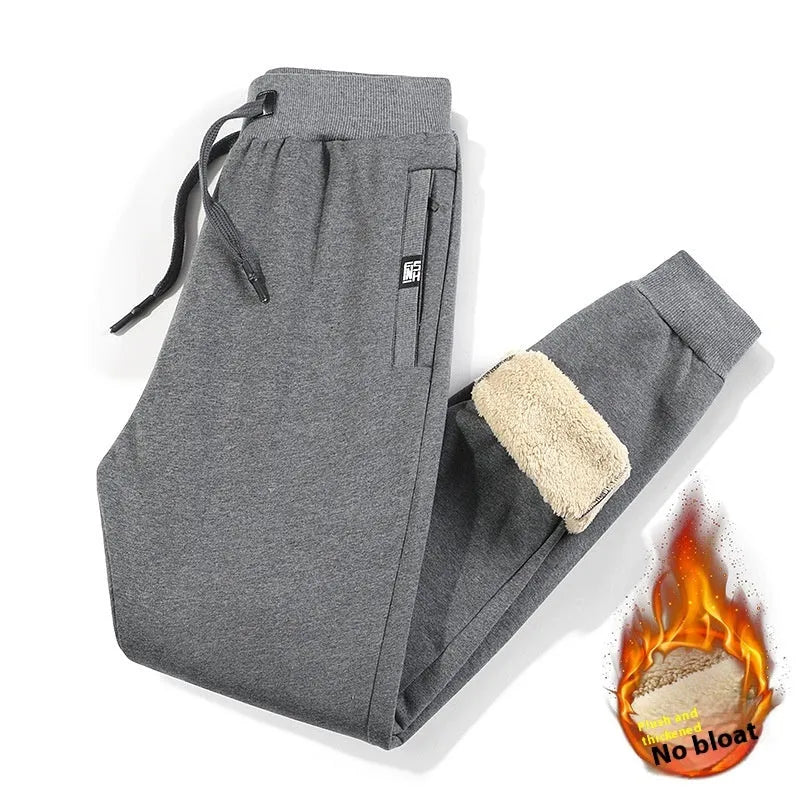 Men's gray fleece-lined track pants with drawstring waist in oversized fit