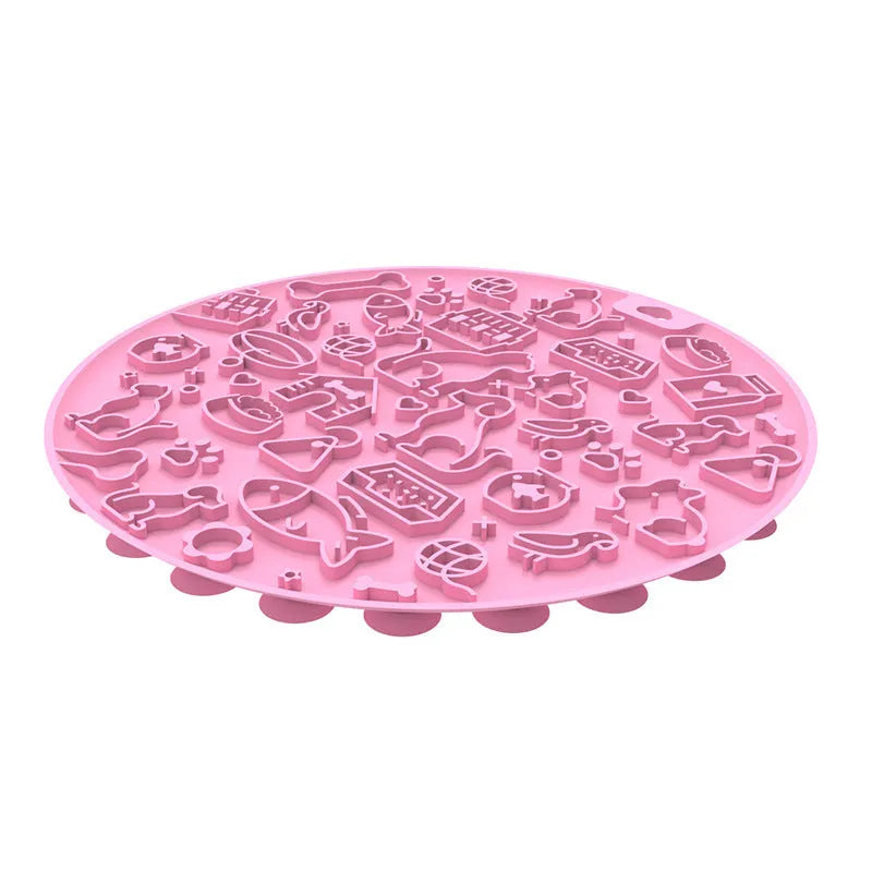 Round silicone pet licking mat with suction cup base in blue colour on smooth surface