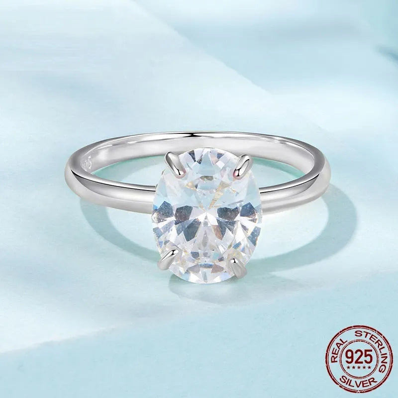 Silver oval cut zircon engagement ring with gold colour electroplating finish on white background