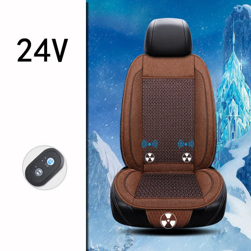 Square black car seat ventilation cushion with power cord, shown on a car seat.