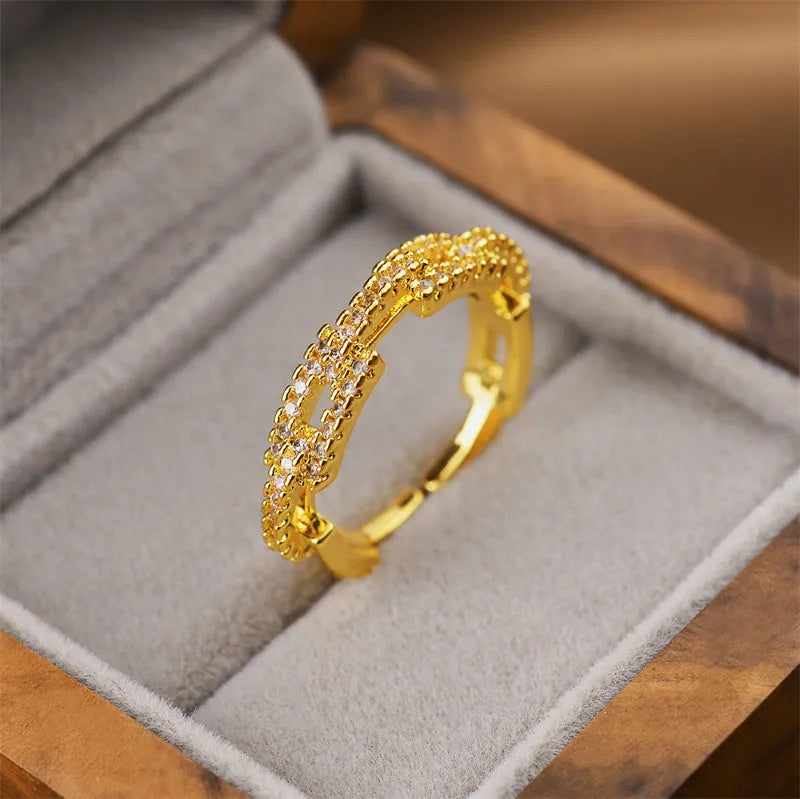 Gold geometric open fashion ring made from electroplated copper, shown in a Korean-inspired style.