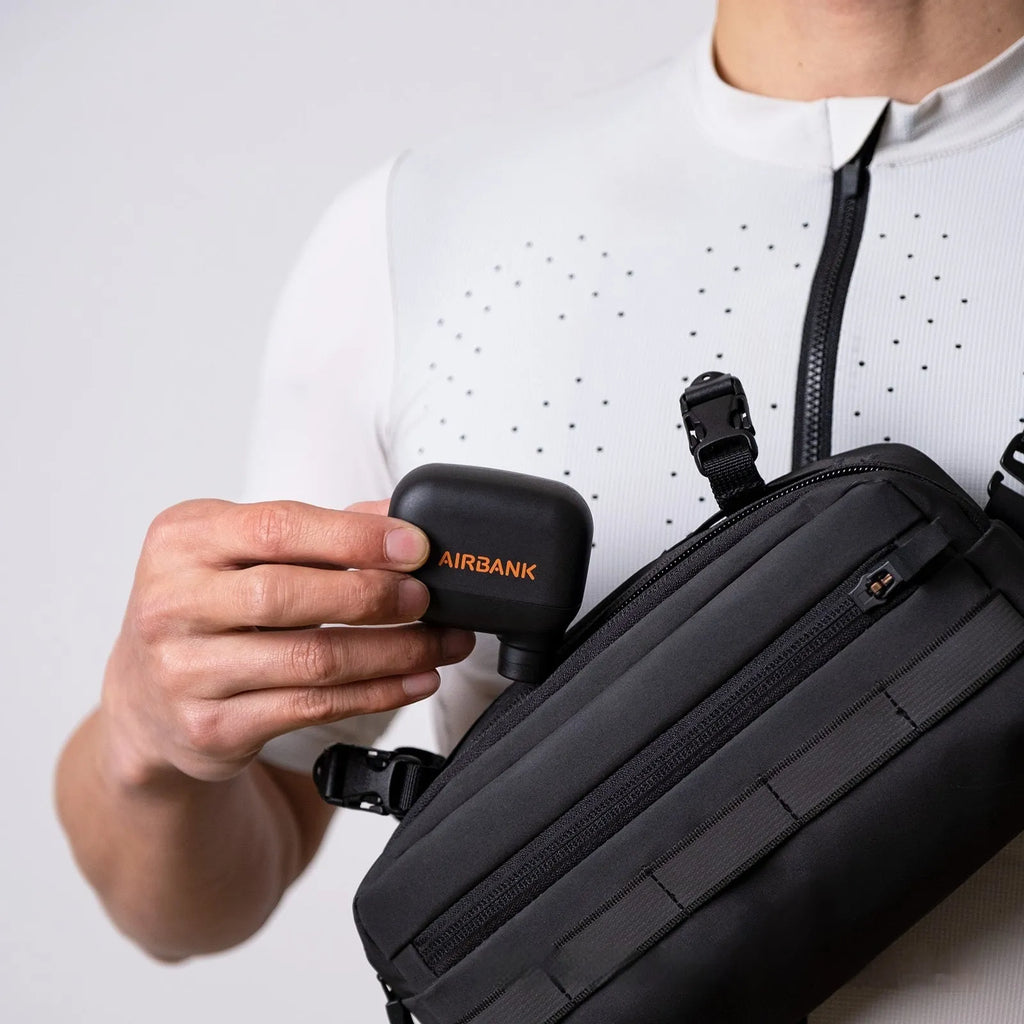 Black AS100 electric bicycle tyre inflator pump with USB charging cable and waterproof bag
