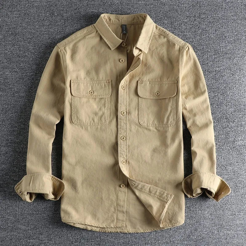 Men's light grey loose fit cardigan-style shirt with an overalls design and long sleeves.