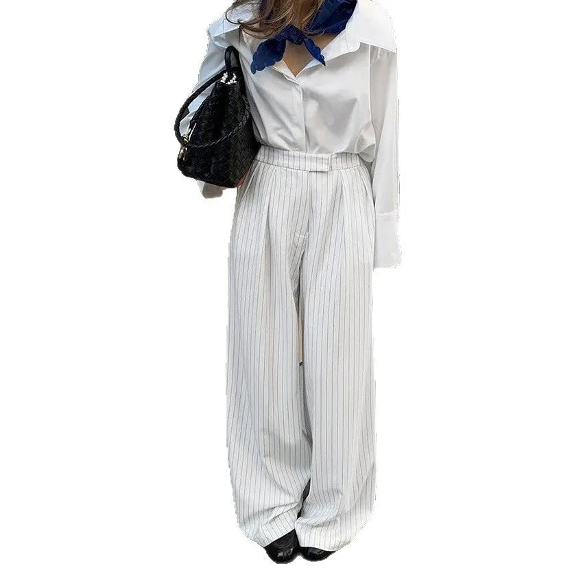 White striped loose fit wide-leg commuter trousers with zip fastening
