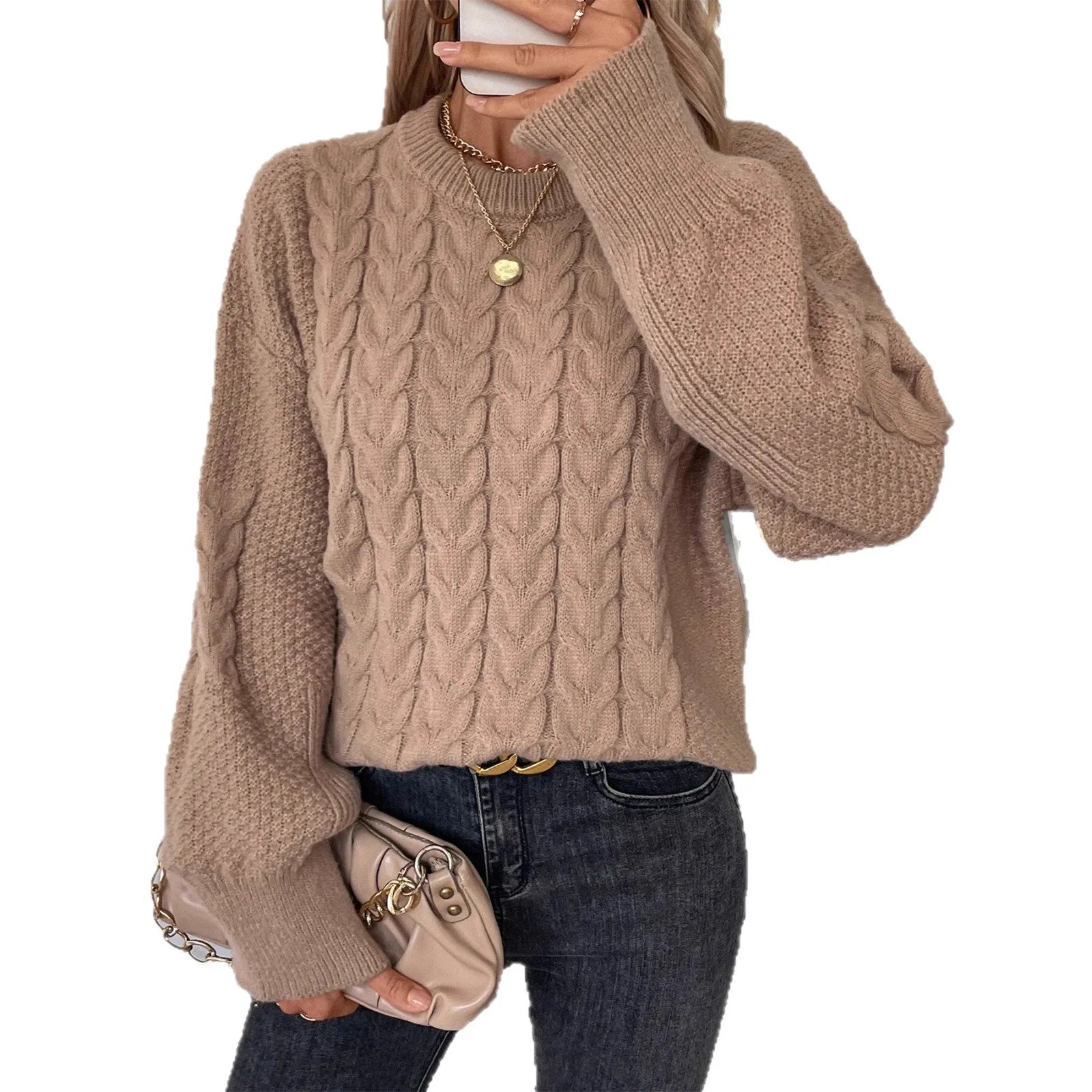 Beige women's loose casual sweater with round neck and a subtle twist design detail on the front