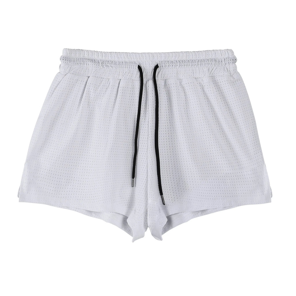 Men's white and black quick-drying nylon sports shorts on a size chart background.