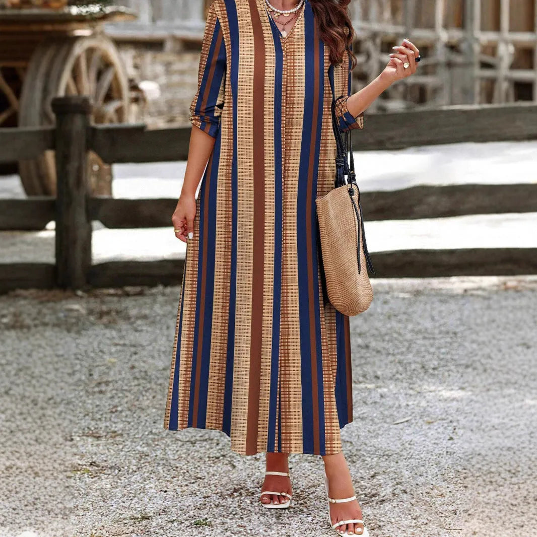 Camel coloured vertical striped V-neck knitted dress with A-line skirt and long sleeves