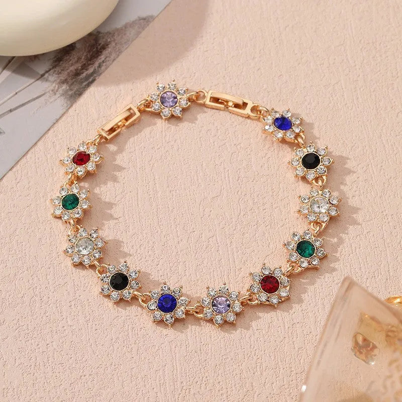 Floral zinc alloy bracelet with electroplated gold or silver finish and gemstone colour variants