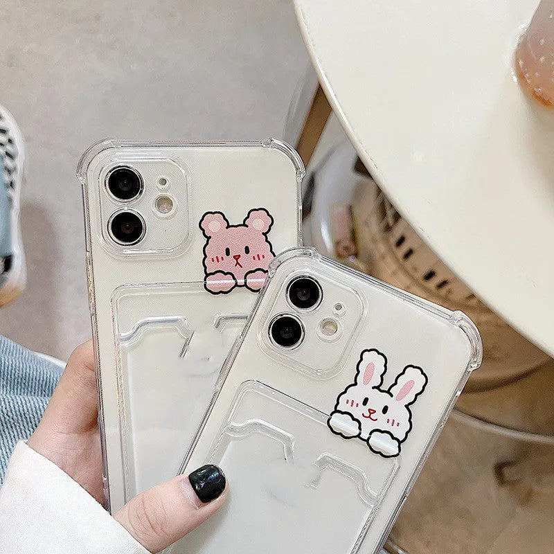 Transparent cartoon-design phone case with a card slot on the back, fitted on an iPhone.