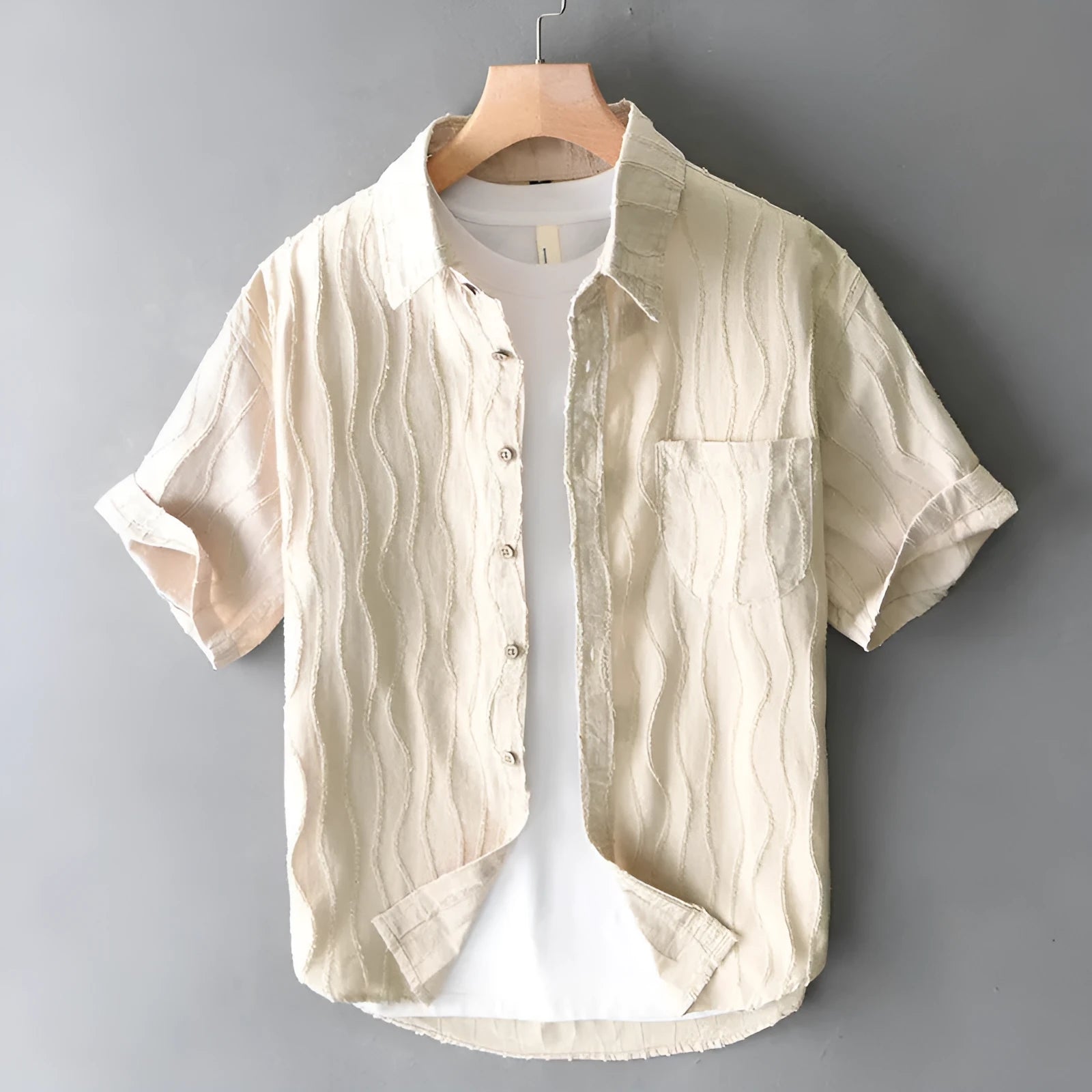Men's loose-fitting pure cotton casual shirt in apricot colour with short sleeves.