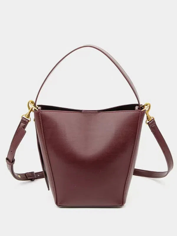 Urban minimalist crossbody shoulder bag in bucket style, PU material, solid colour, three-dimensional outer pocket, available in black, army green, and wine red